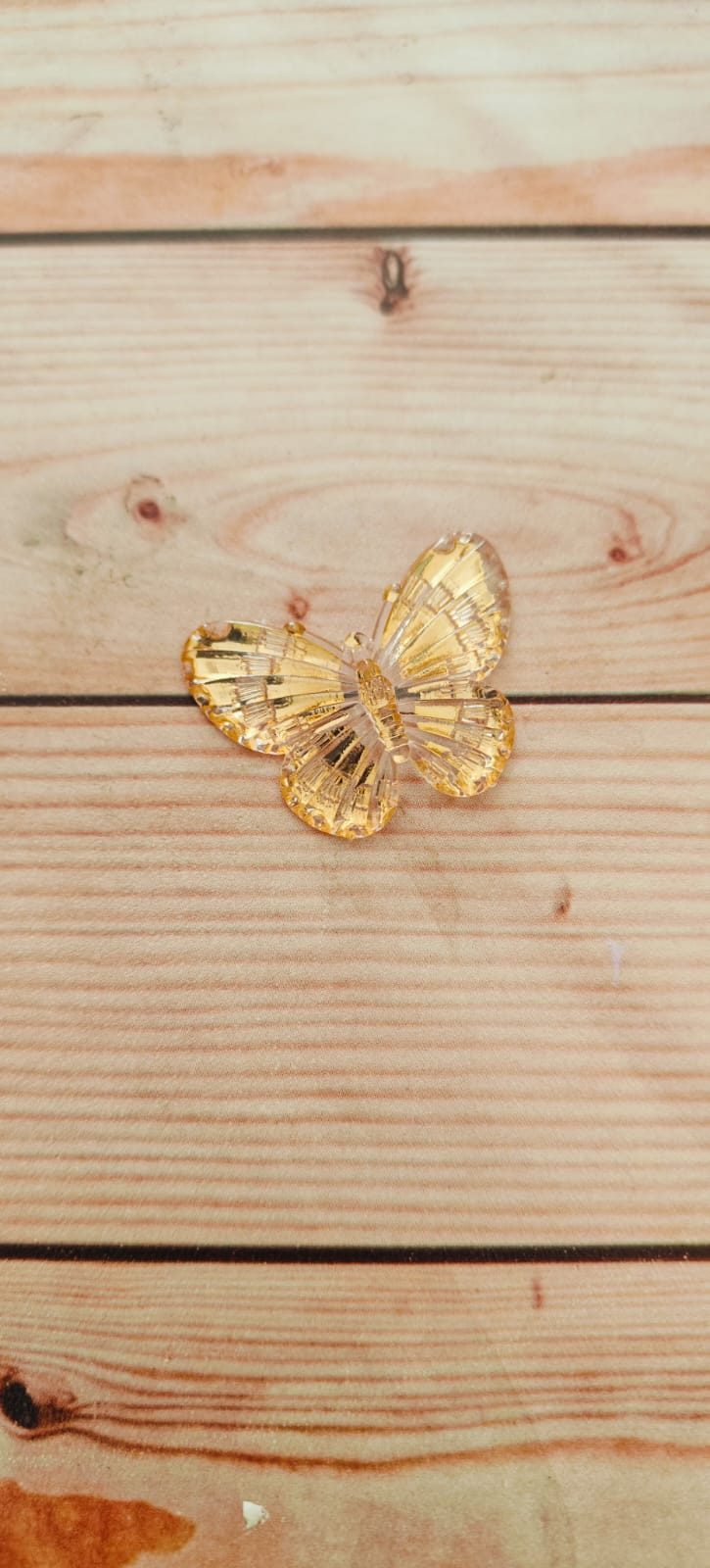 Golden butterfly with hanging hole